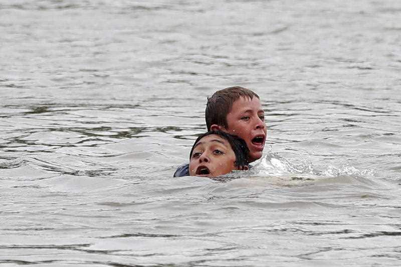 Honduran migrants cross the Suchiate River, which separates Guatemala from Mexico.