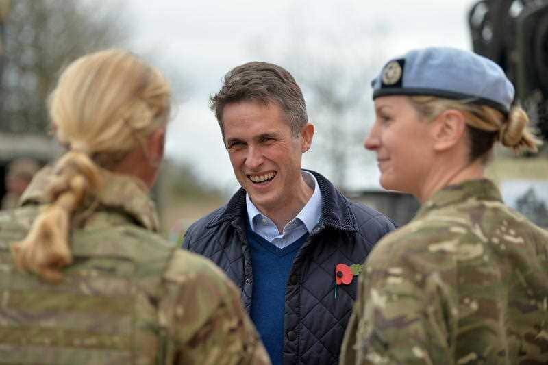 British Secretary of State for Defence, Gavin Williamson, talking to female personnel.