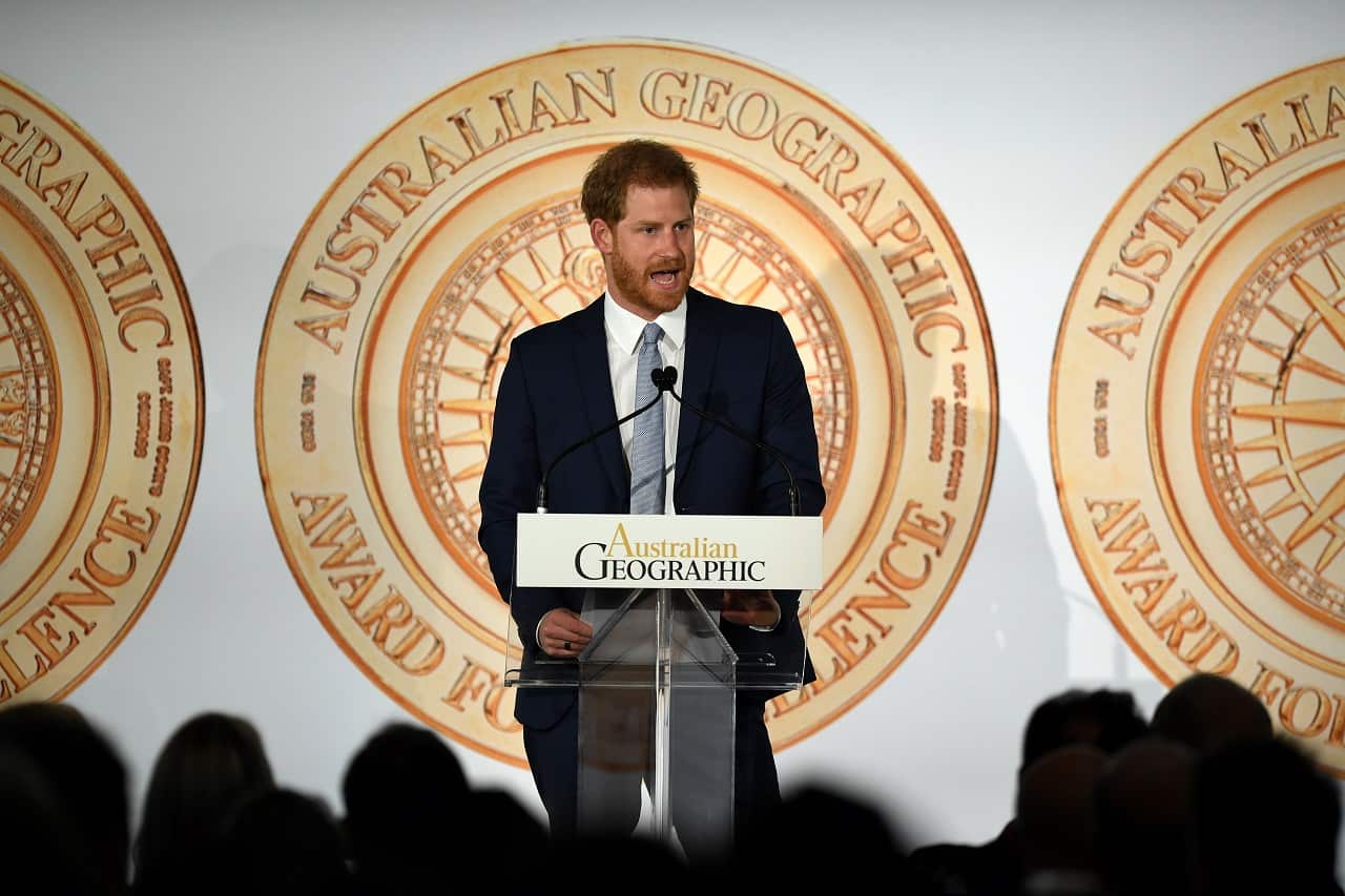 Britain's Prince Harry speaks after accepting a medal for the Queen's Commonwealth Canopy project at the Australian Geographic Society Awards.