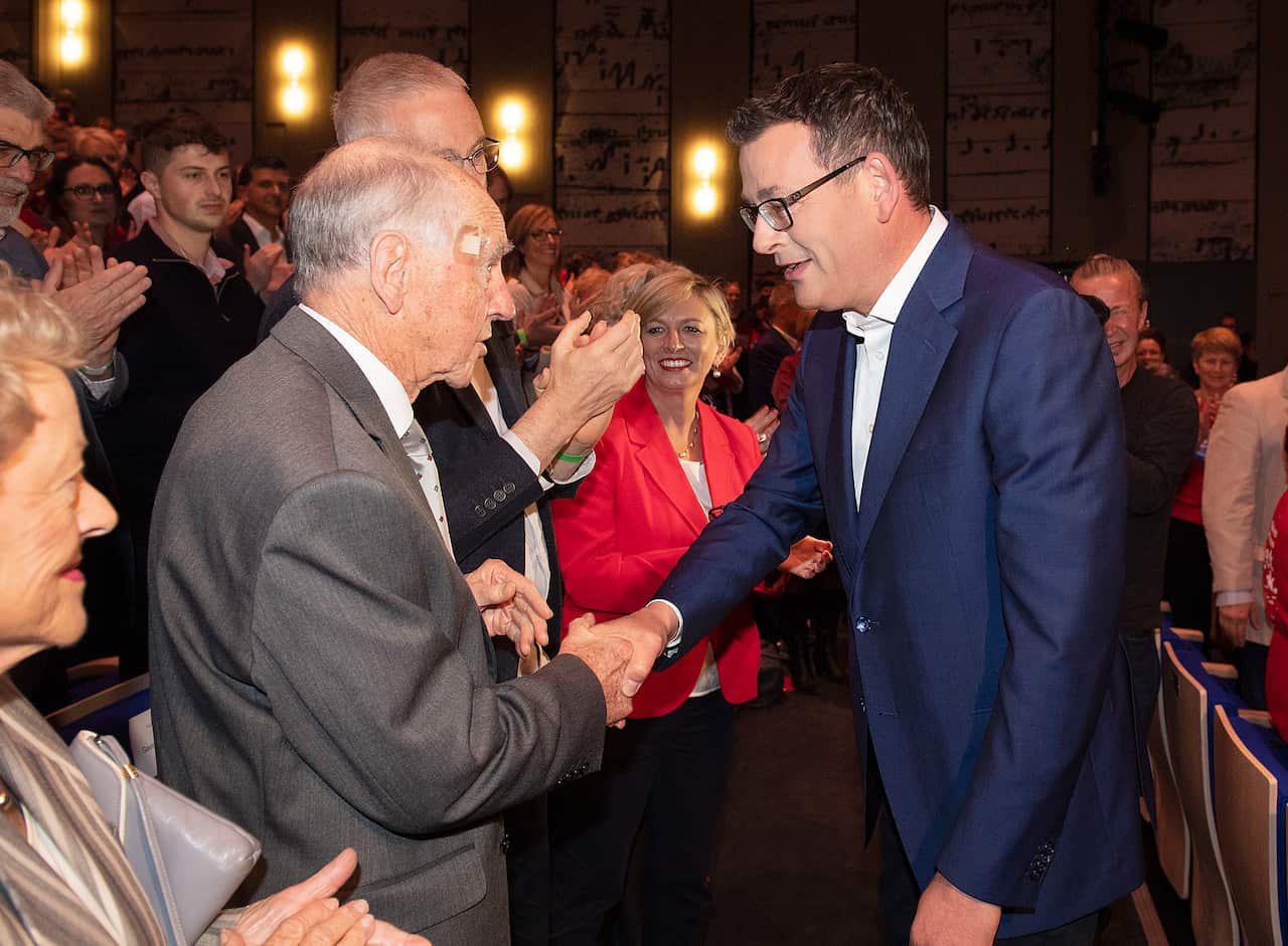 Former Victorian Premier John Cain greets current Premier Daniel Andrews during Labor's election campaign.