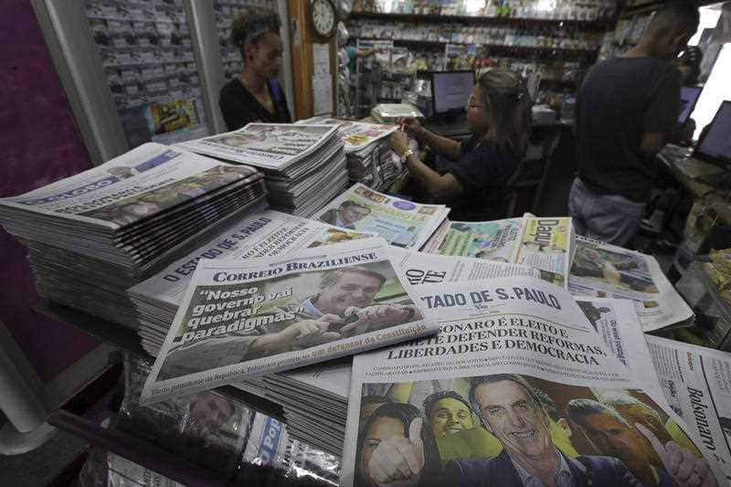 Newspaper headlines lead with the presidential victory of far-right congressman Jair Bolsonaro, in Brasilia, Brazil, Monday, Oct. 29, 2018.