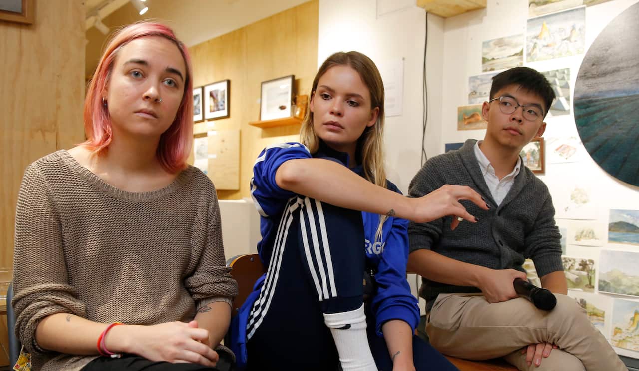 Veronica Nikulshina, Olga Kuracheva and Joshua Wong on November 3.