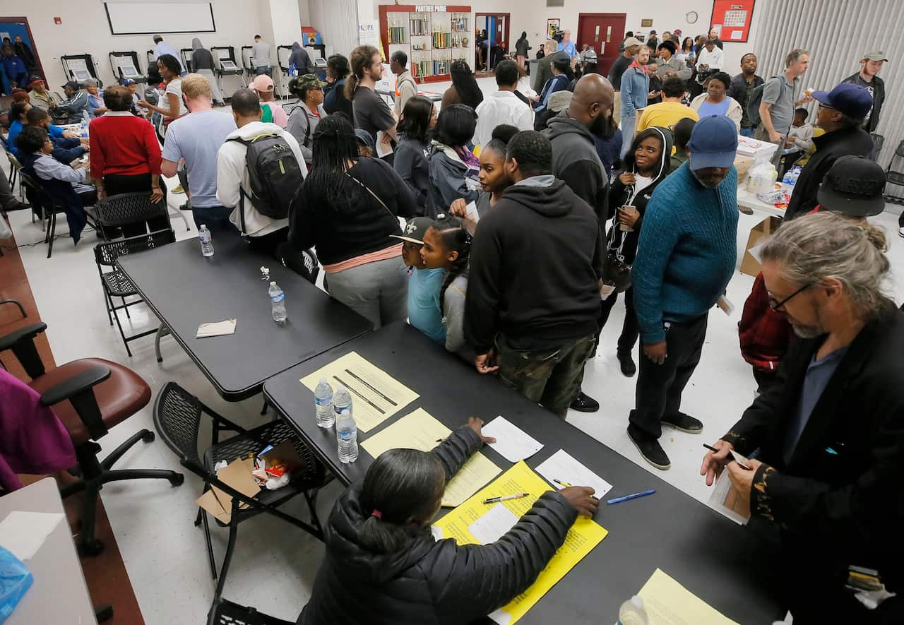 The wait time to vote at the Pittman Park precinct in Atlanta was reported to be three hours. Pizza and snacks were donated for the people waiting in line.