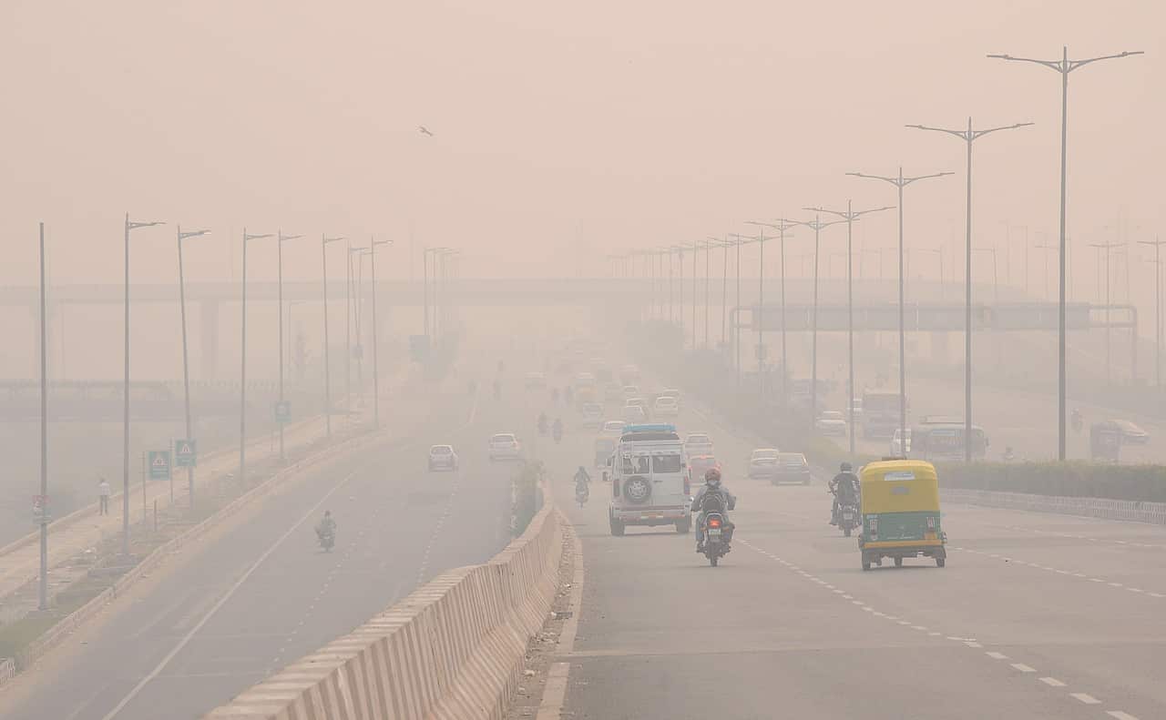 A train moves through heavy smog one day after the Diwali festival in New Delhi in 2018.