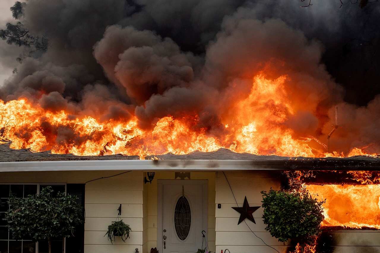 Flames consume a home.