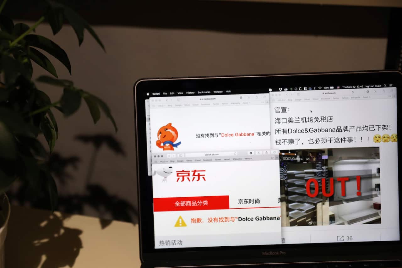 A computer screen shows the online impact on Dolce & Gabbana products displayed in Beijing, China.