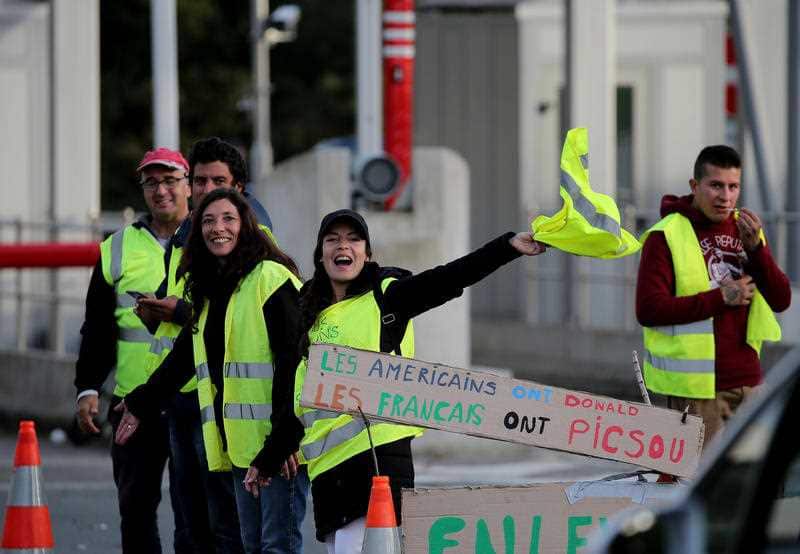 Demonstrators open the toll gates on motorway near Biarritz, southwestern France