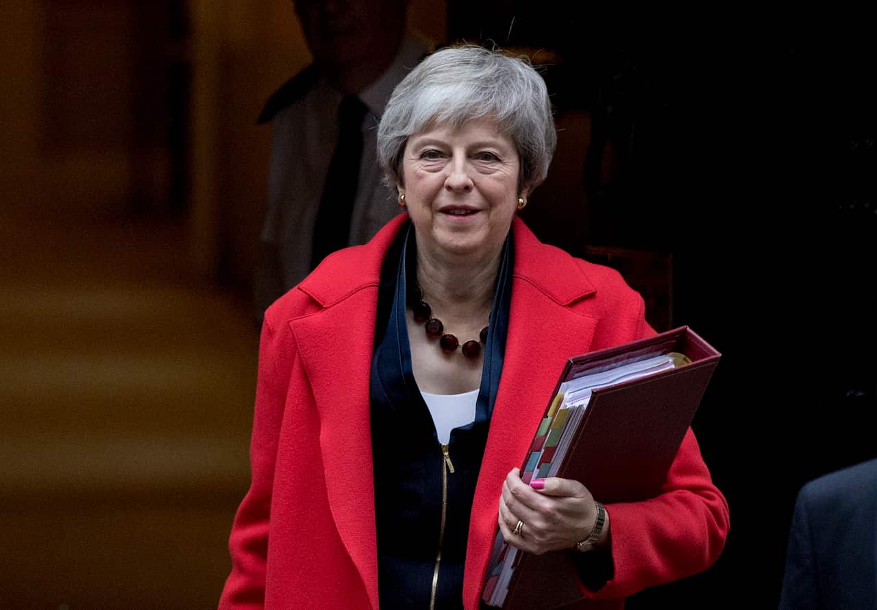 British Prime Minister Theresa May leaves No.10 Downing Street as she makes her way to The House of Commons.