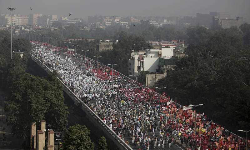 Indian farmers and agricultural laborers march towards the Indian Parliament during a protest rally in New Delhi, India, Friday, Nov. 30, 2018.