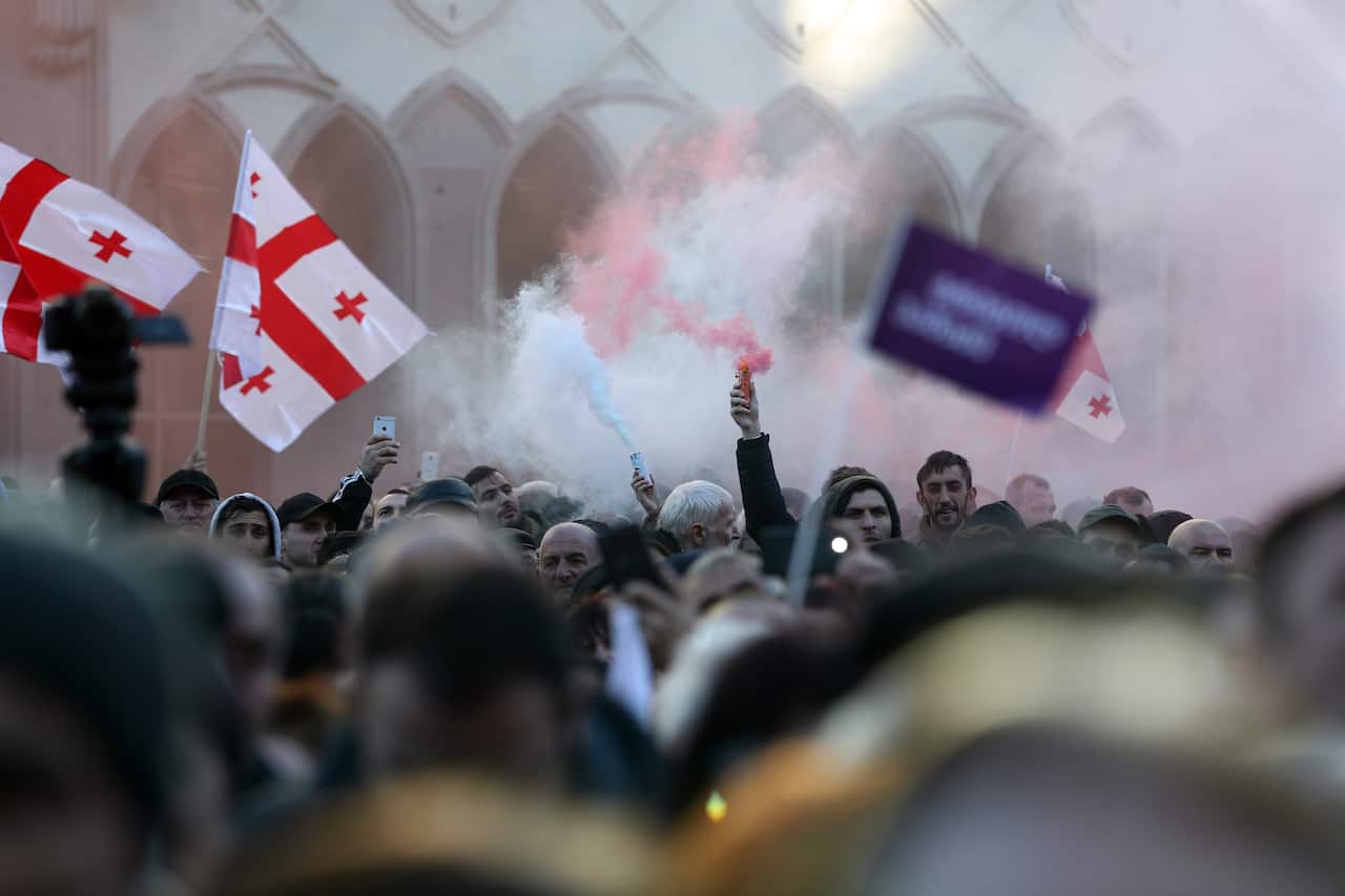 Supporters of Georgian opposition presidential candidate Grigol Vashadze attend a protest rally in Tbilisi, Georgia