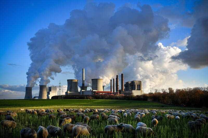 Steam rises from the brown coal-fired power plant Neurath and Niederaussem operated by RWE in Bergheim, Germany.