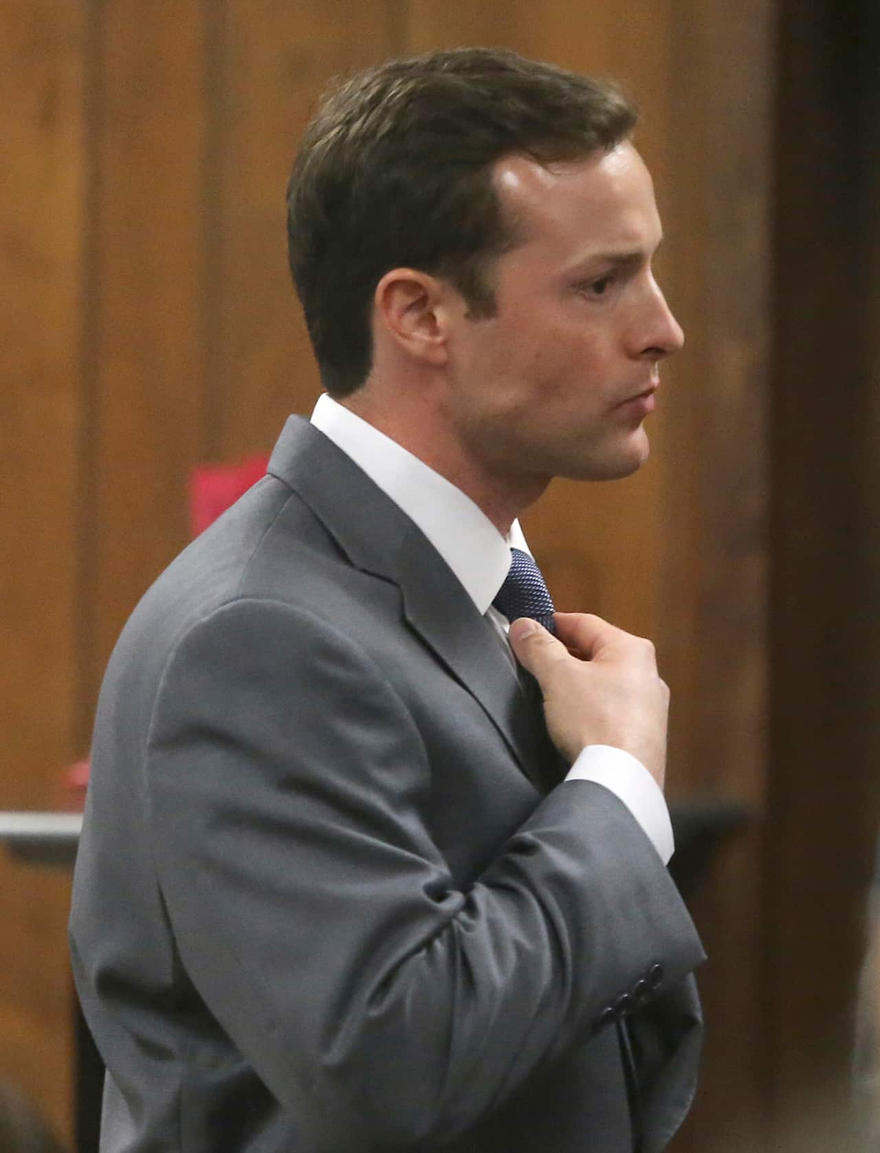 Former Baylor University fraternity president Jacob Anderson adjust his tie in the courtroom Monday Dec. 10, 2018 in Waco, Texas.