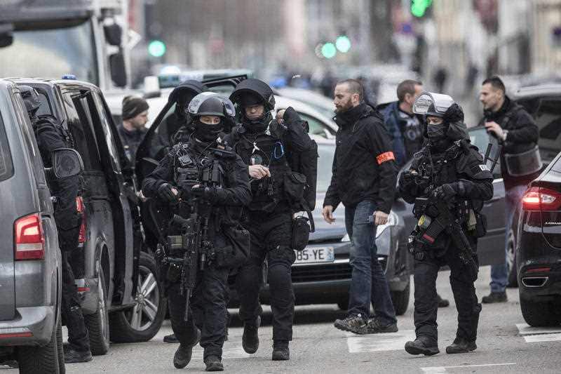 French police forces take position in the Neudorf district of Strasbourg, eastern France, Thursday, Dec. 13, 2018.