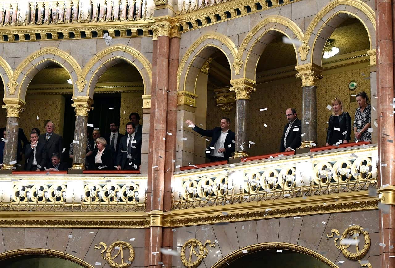 Opposition lawmakers protesting the bill in Parliament this month. They blew whistles and sounded sirens to slow its passage.