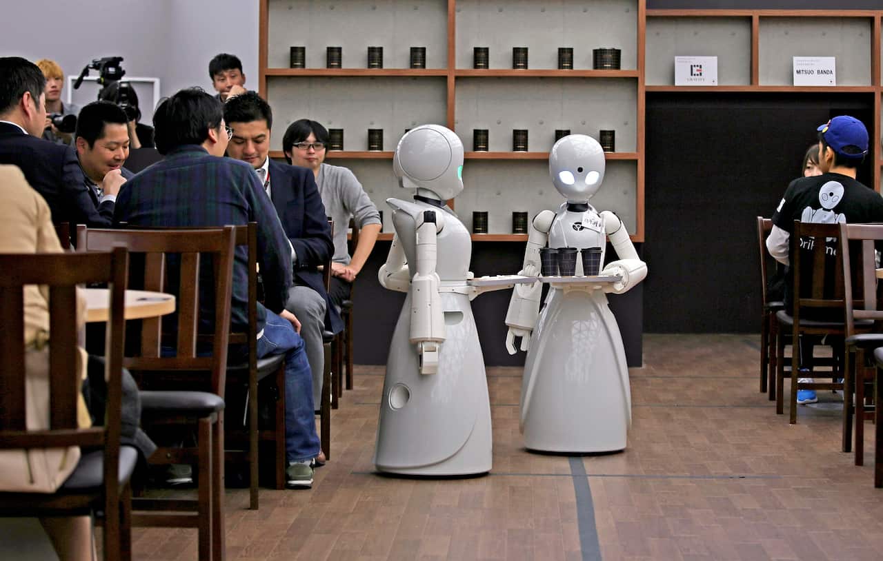 Robots serve customers at cafe in Tokyo, Japan.