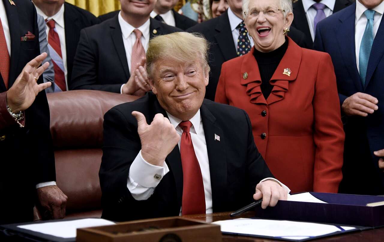 President Donald Trump gives the thumbs up during a signing ceremony for S. 756, First Step Act and H.R. 6964, Juvenile Justice Reform Act in Washington.