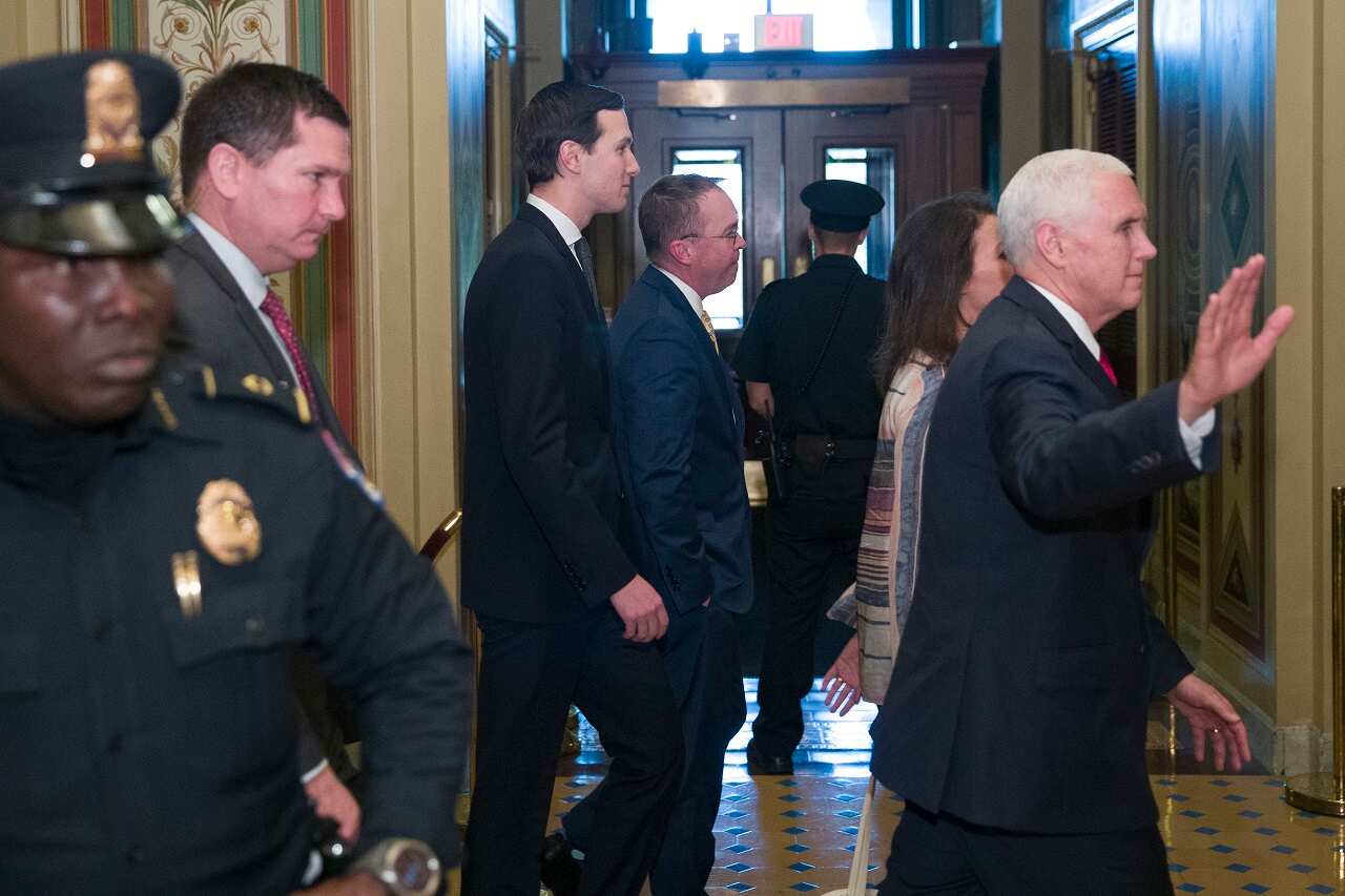 VP Mike Pence, right, walks with incoming White House Chief of Staff Mick Mulvaney and White House senior adviser Jared Kushner on talks to avert govt shutdown.