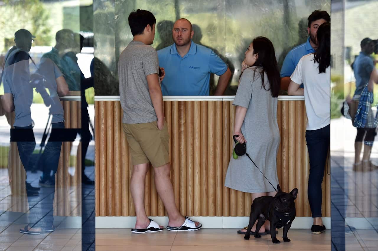 Residents being offered information at the Opal Tower at Sydney Olympic Park.