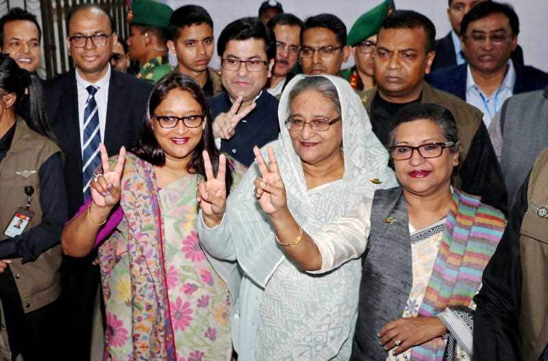 Bangladeshi Prime Minister Sheikh Hasina (C), after casting her vote at a polling station in Dhaka.