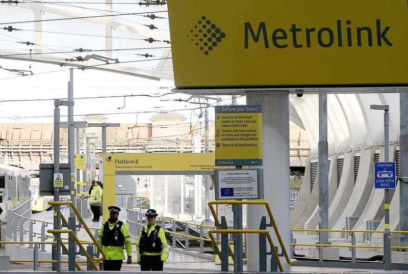 A general view of police officers at Manchester Victoria Metrolink station,