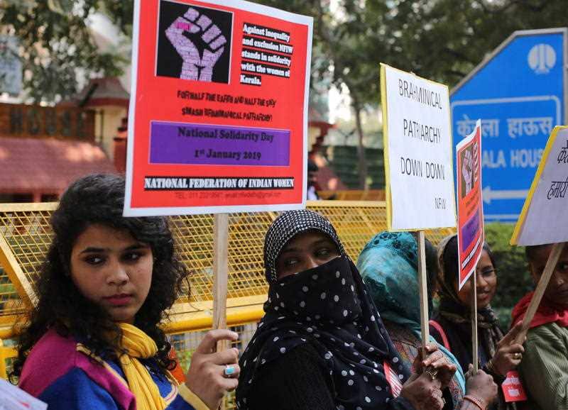 Indian activists hold placards as they take part in a solidarity protest in New Delhi, India.