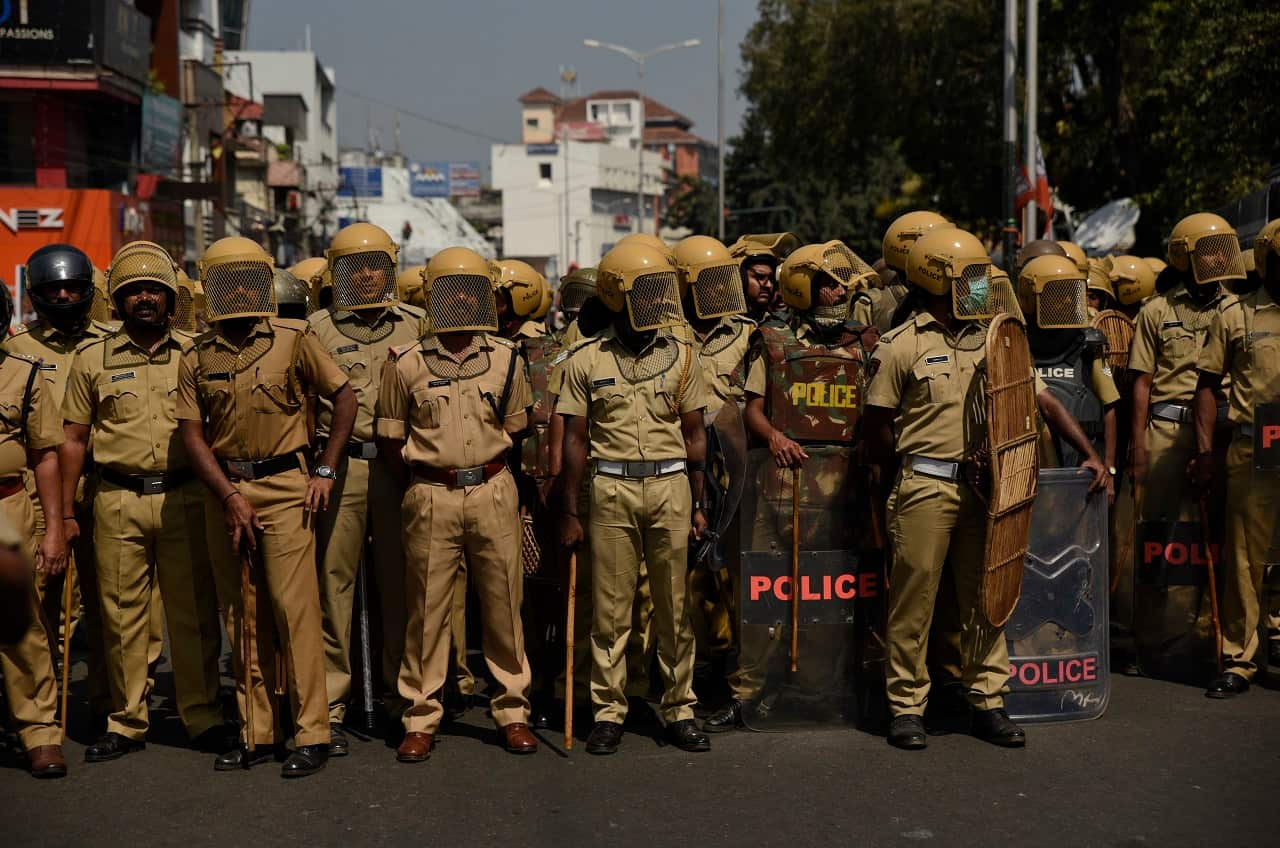 Policemen stand guard in Thiruvananthapuram.