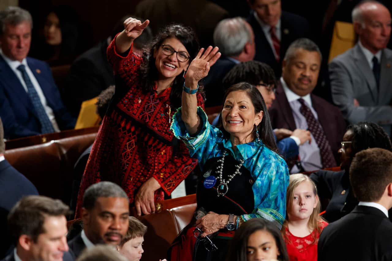 Rashida Tlaib and Deb Haaland, look up to the gallery before Nancy Pelosi of California is sworn as House Speaker at the US Capitol in Washington, January, 2019