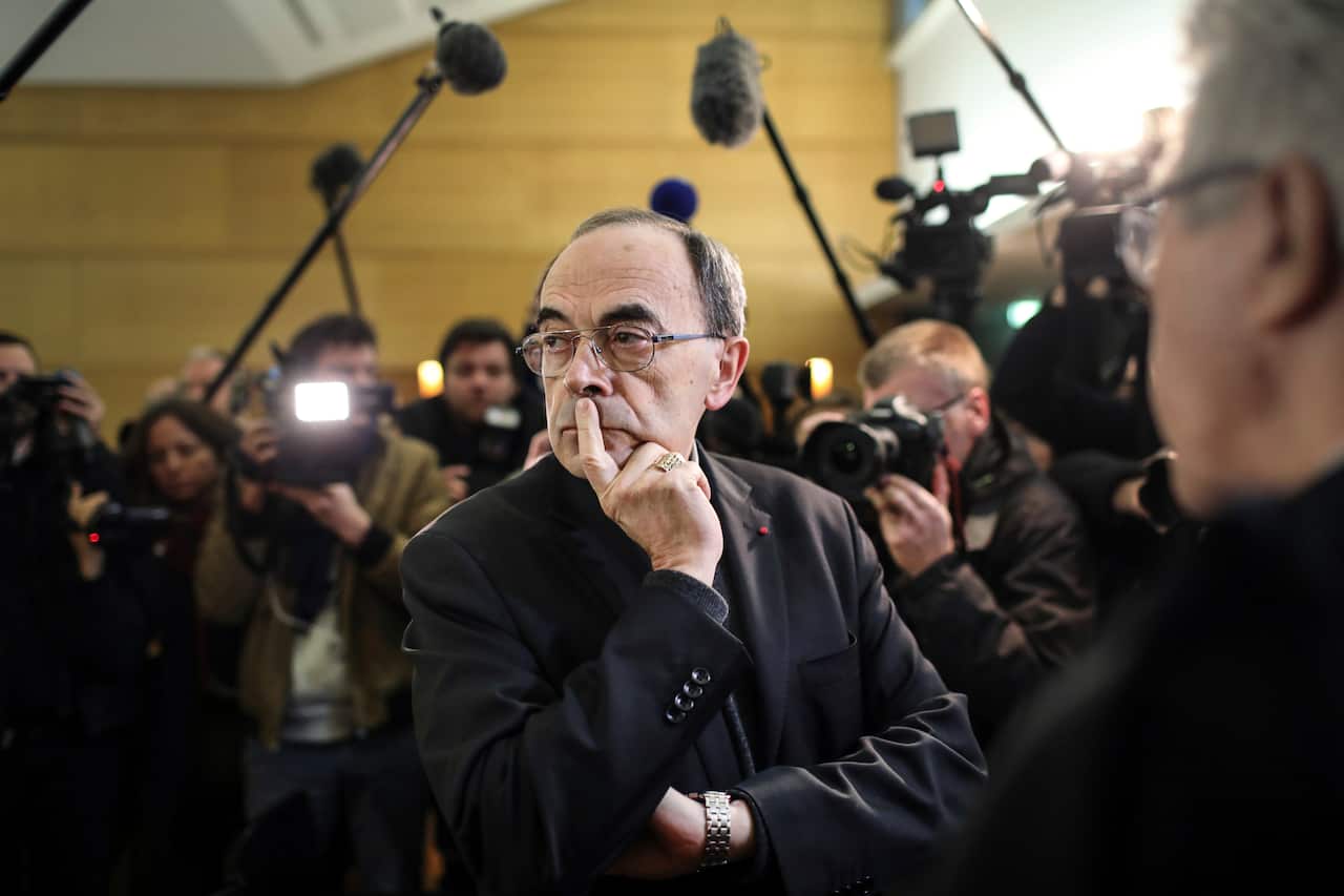 Cardinal Philippe Barbarin waits for the start of his trial at the Lyon courthouse, central France.