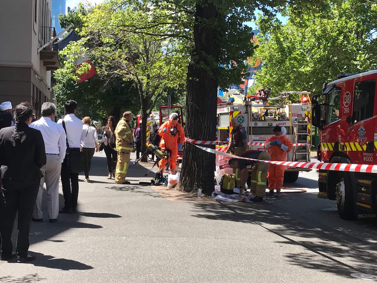 Hazmat and fire crews are seen outside the Indian and French Consulates on St Kilda Road in Melbourne.