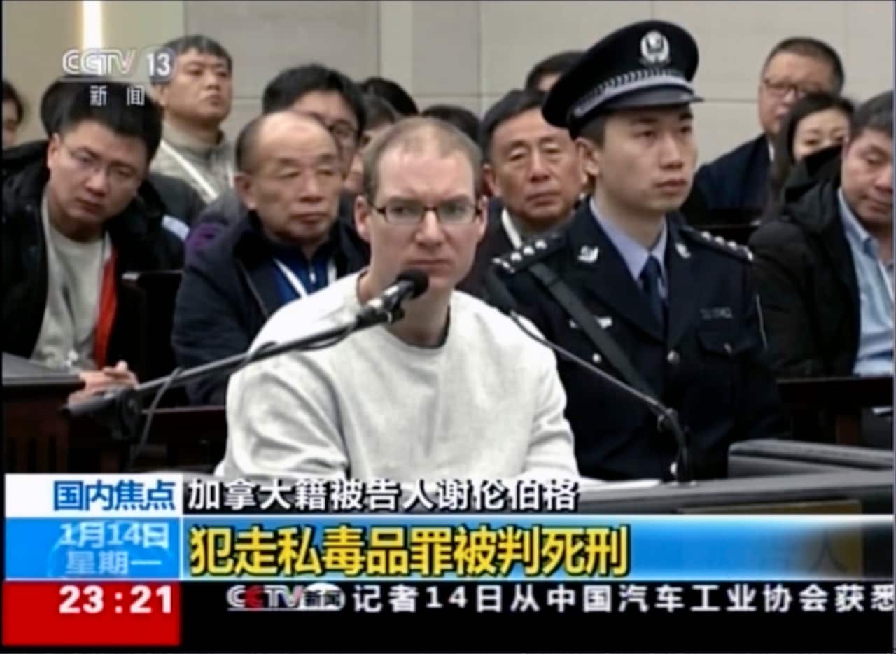 Canadian Robert Lloyd Schellenberg attends his retrial at the Dalian Intermediate Peoples Court in Dalian, northeastern China's Liaoning province 