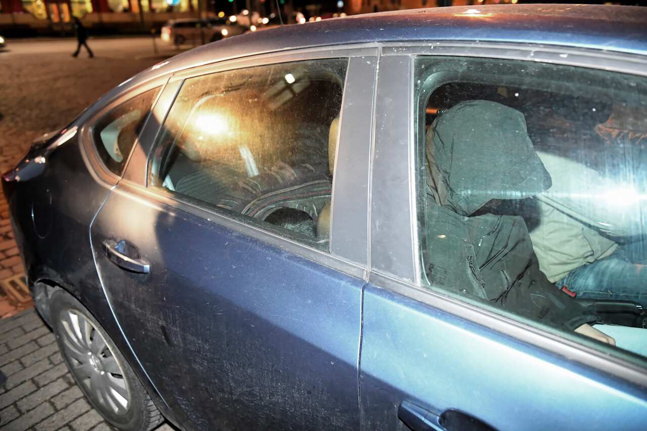 Stefan W. (L), suspected of murdering the Mayor of Gdansk Pawel Adamowicz, leaves the District Prosecutor's Office in Gdansk.