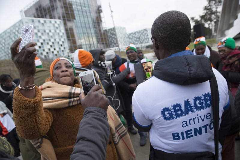 Supporters of Laurent Gbagbo rally outside the International Criminal Court.
