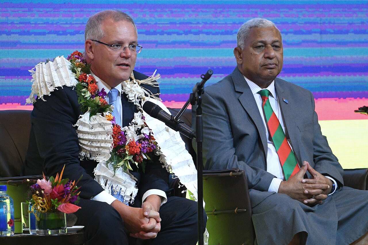 Prime Minister Scott Morrison (left) sits with Fiji Prime Minister Frank Bainimarama (right). The government hopes to strengthen ties with Fiji.  
