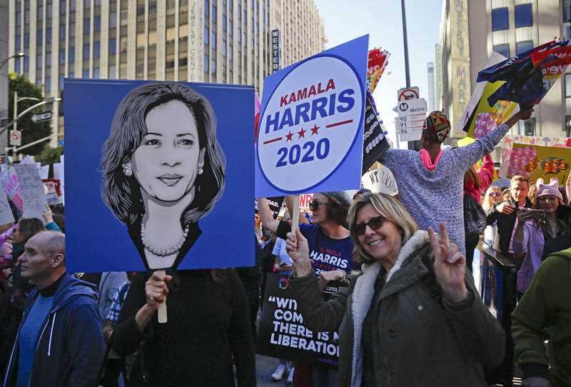 n this Saturday, Jan. 19, 2019, photo demonstrators hold posters of Kamala Harris 2020 during the Women's March in Los Angeles. 