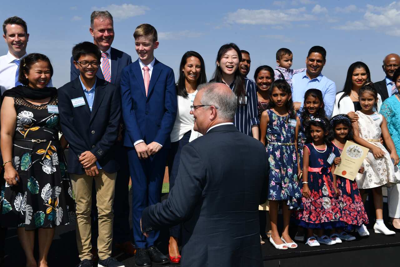 Prime Minister Scott Morrison with newly sworn Australian citizens earlier this year.