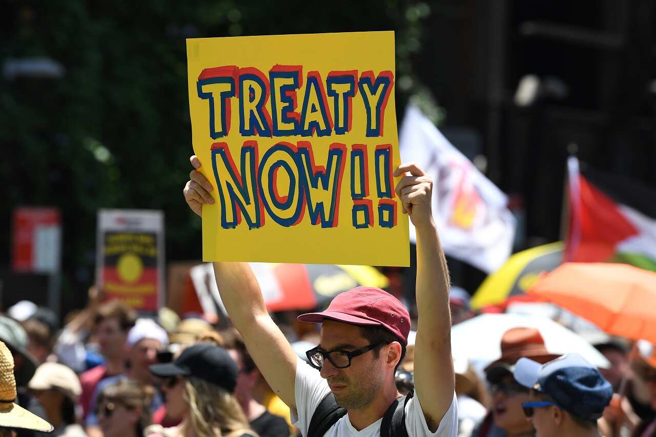 Protesters take part in an 'Invasion Day Rally' in Sydney.