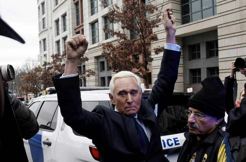 Roger Stone, a longtime adviser to President Donald Trump, gestures as he leaves court.