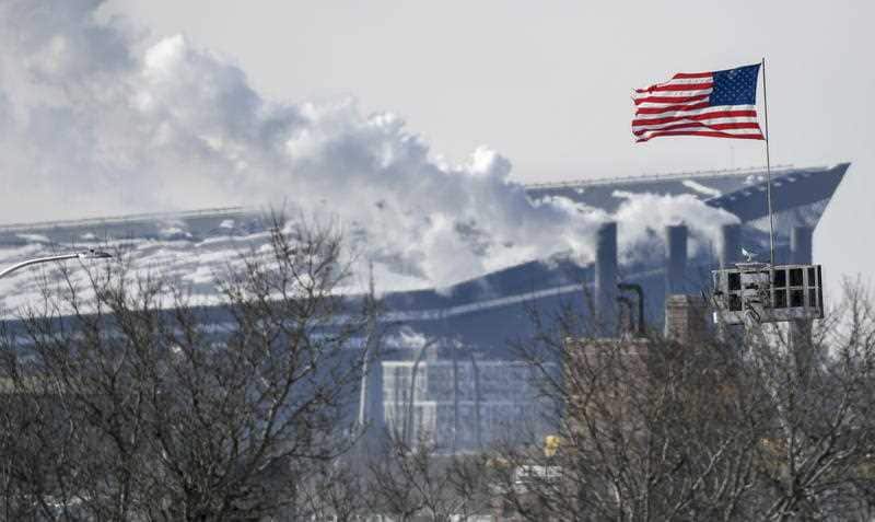 A US flag shows the strong winds that have combined with plunging temps create windchills reaching -34 degrees Celsius in Minnesota.