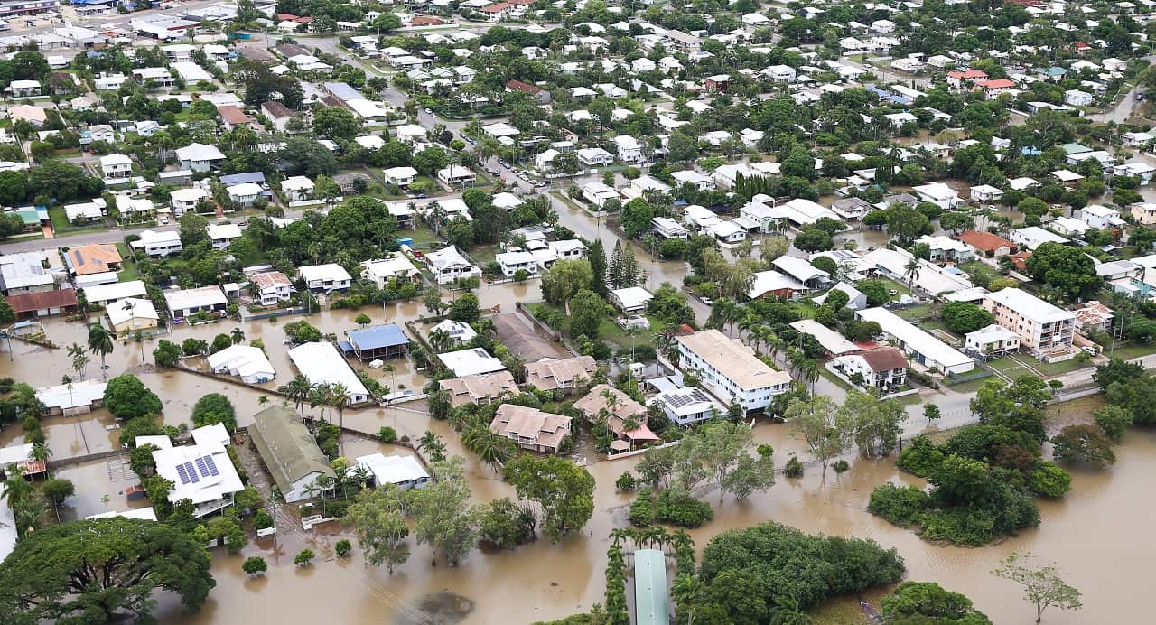 Houses inundated with flood waters are seen in Townsville.