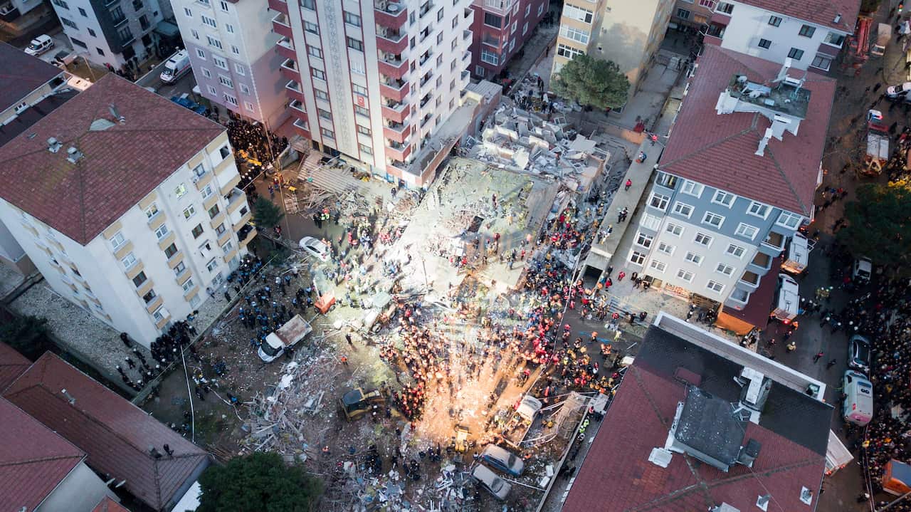An aerial picture taken with drone shows rescuers working at the site of a collapsed building in Istanbul, Turkey, 06 February 2019. 