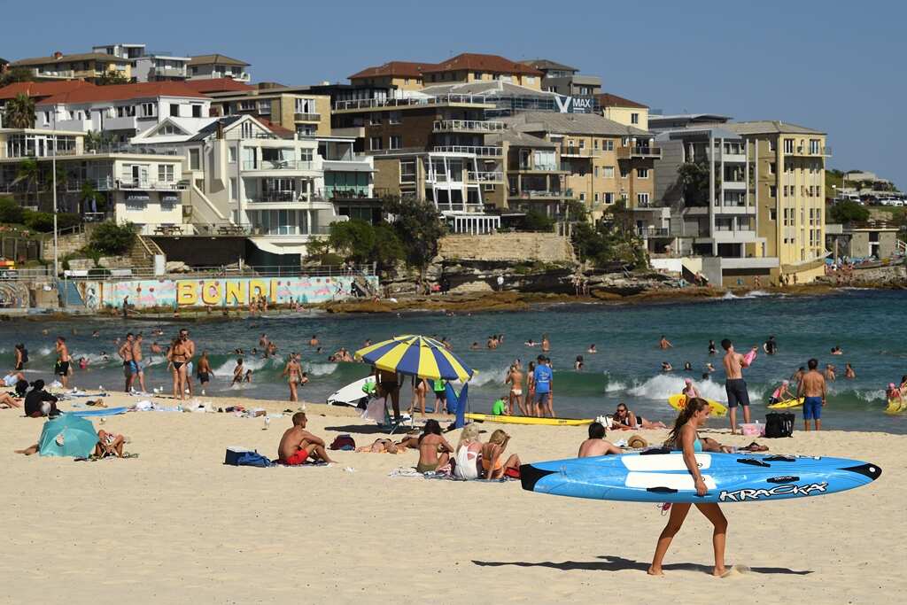 Beachgoers cool off in the water at Bondi Beach in Sydney, Tuesday, February 12, 2019. (AAP Image/ Joel Carrett) NO ARCHIVING