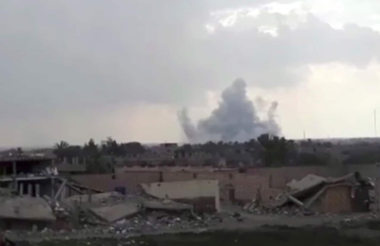 Smoke rising from a shell that targeted Islamic State.