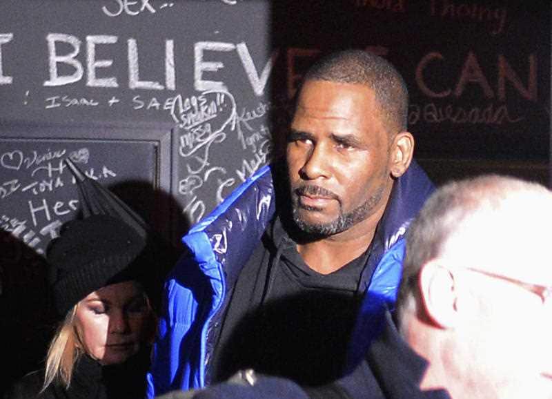 R Kelly leaves his Chicago studio on his way to surrender to police.