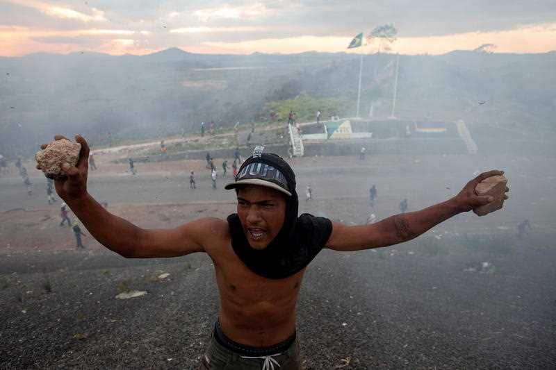 Opponents of Venezuelan President Nicolas Maduro clash with members of the Bolivarian National Guard of Venezuela