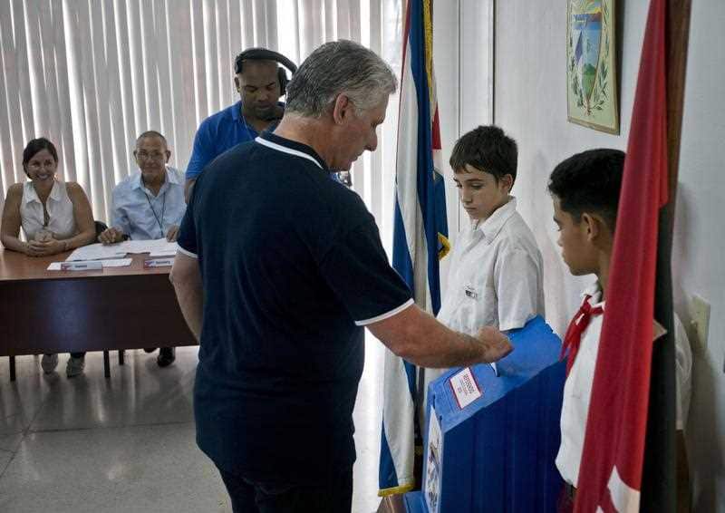 Cuba's President Miguel Diaz-Canel votes during a referendum to approve or reject the new constitution in Havana, Cuba, Sunday, Feb. 24, 2019. 