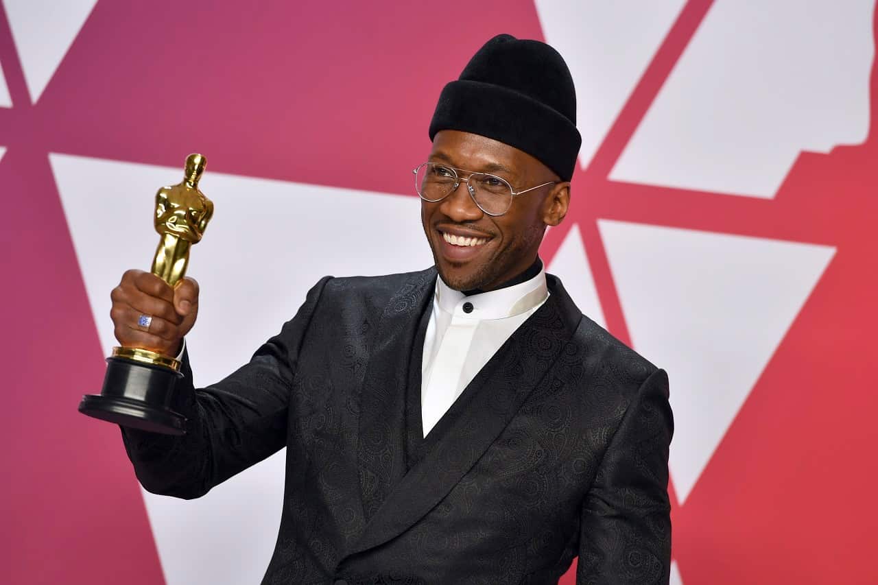 Mahershala Ali poses with the award for best performance by an actor in a supporting role.
