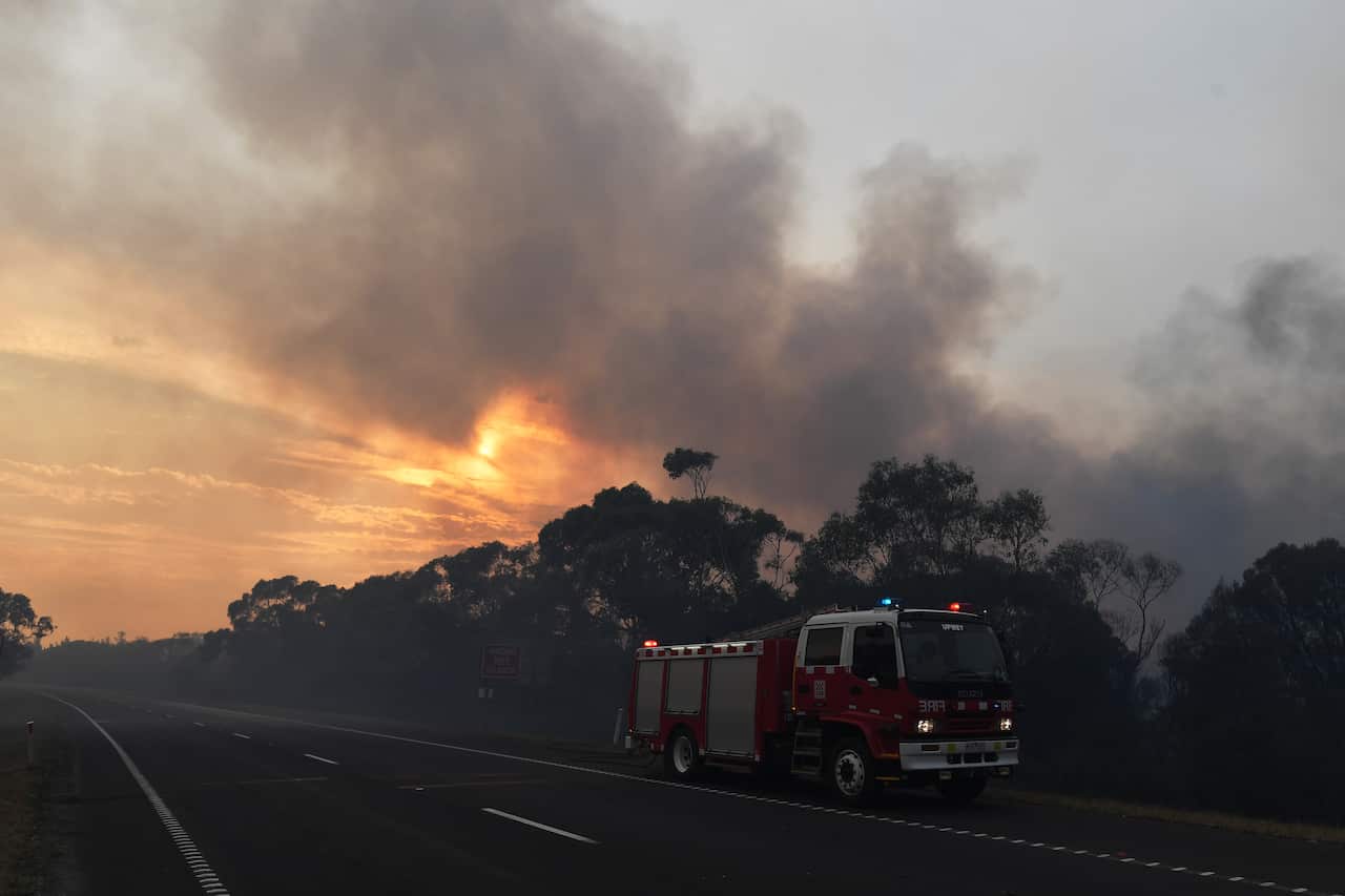 A CFA fire crew is seen along the Princes Highway outside of Bunyip in Victoria.