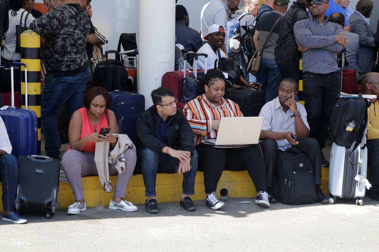 Stranded passengers wait for their flights out of JKIA airport in Nairobi, Kenya.