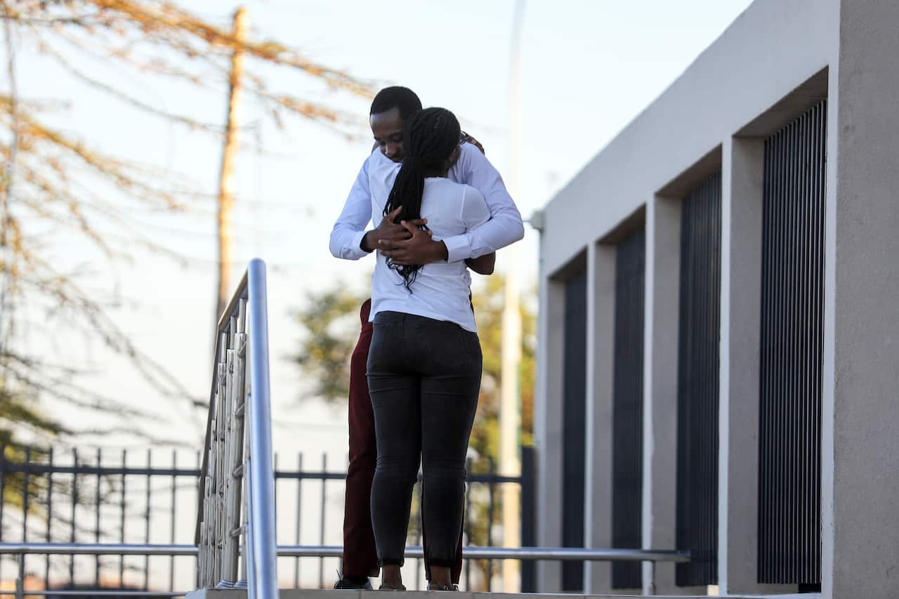 Relatives comfort each other at a help centre set up for the relatives of passengers of crashed Ethiopian Airlines Flight 302.
