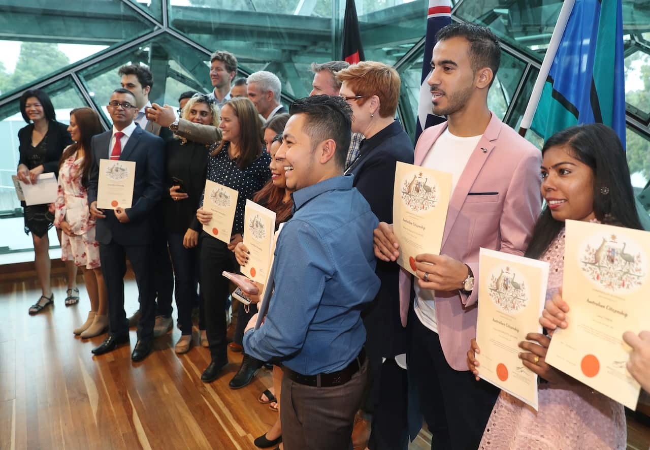 Refugee footballer Hakeem Al-Araibi (second from right) receives his Australian citizenship.